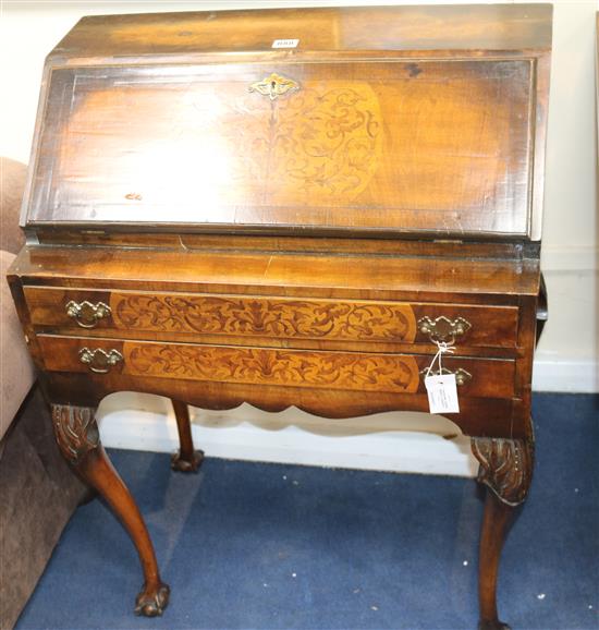 A George III design banded mahogany bureau, inset with contra partie marquetry panels, fitted two drawers, W.67cm